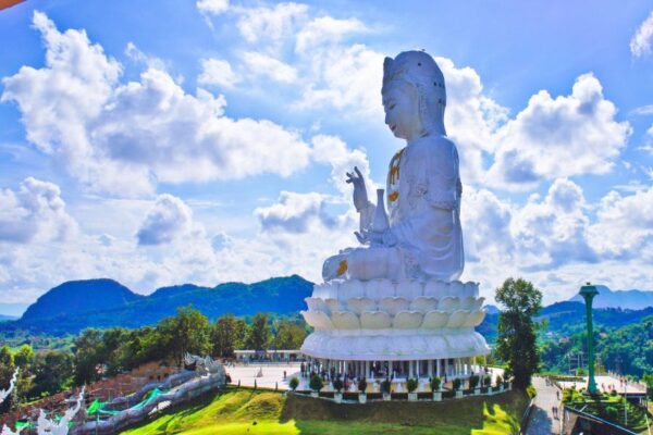 a large white statue at Red Temple Chiang Rai, Thailand by Voyon tour